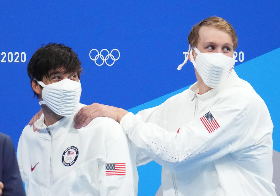 American swimmers Chase Kalisz (right) and Jay Litherland both had to wear masks on the podium ... at least for some of it. (Robert Hanashiro-USA TODAY Network)