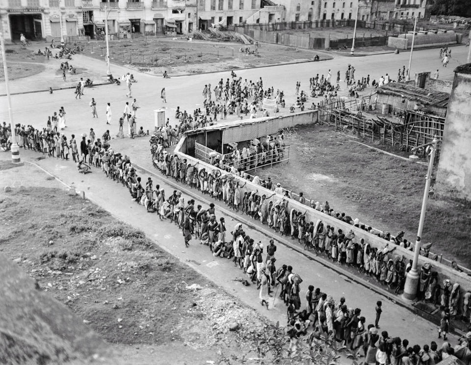 Indian citizens wait in line at a soup kitchen in Calcutta, October 1943 at the peak of the famine. (Bettmann Archive)