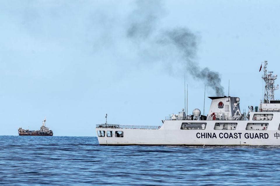 A China Coast Guard vessel and the Sierra Madre on Nov. 10. (Photo: Lisa Marie David/Bloomberg)