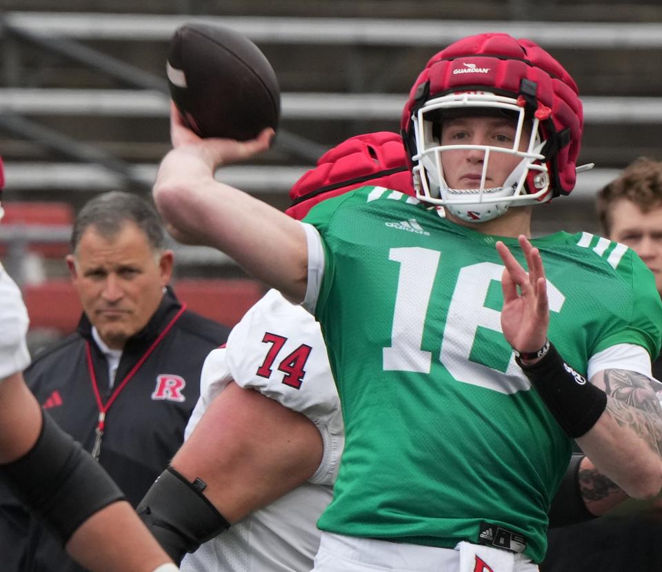 Piscataway, NJ -- April 27, 2024 -- Coach Greg Schiano and quarterback, Athan Kaliakmanis during Rutgers annual spring football game at SHI Stadium.