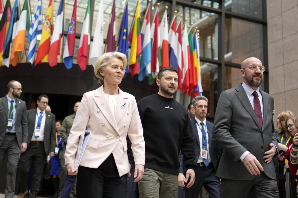 FILE - From left, European Commission President Ursula von der Leyen, Ukraine's President Volodymyr Zelenskyy and European Council President Charles Michel walk together to a media conference at an EU summit in Brussels on Thursday, Feb. 9, 2023. Russia's war on Ukraine will top the agenda when U.S. President Joe Biden and his NATO counterparts meet in the Lithuanian capital Vilnius on Tuesday and Wednesday. (AP Photo/Virginia Mayo, File)