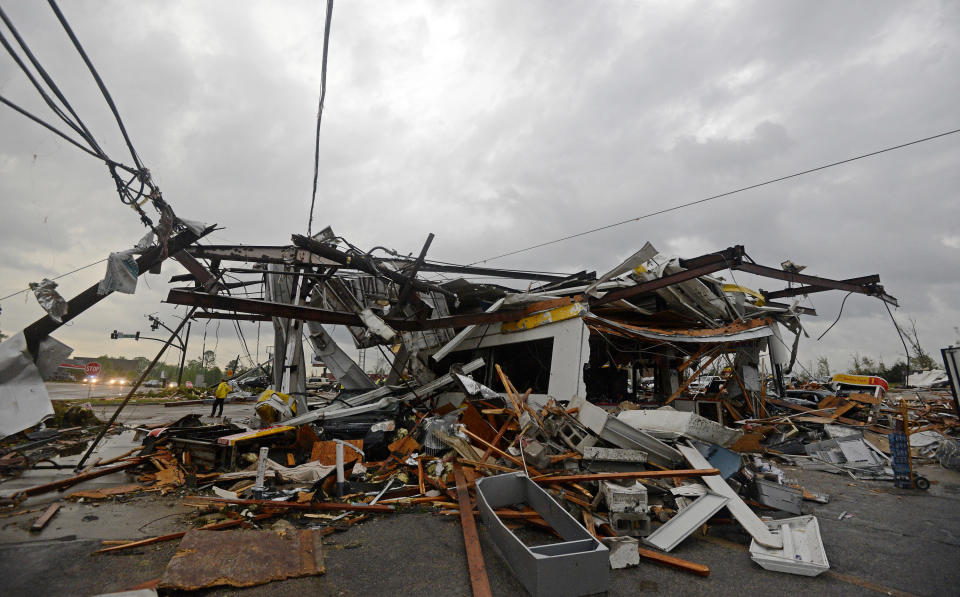 Buildings are damaged along Gloucester Street after a tornado in Tupelo, Miss., Monday, April 28, 2014.T ornados flattened homes and businesses, flipped trucks over on highways and injured numerous people in Mississippi and Alabama on Monday as a massive, dangerous storm system passed over several states in the South, threatening additional twisters as well as severe thunderstorms, damaging hail and flash floods. (AP Photo/The Daily Mississippian, Thomas Graning)