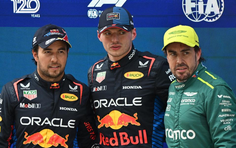 (L-R) Red Bull Racing's Mexican driver Sergio Perez, Red Bull Racing's Dutch driver Max Verstappen and Aston Martin's Spanish driver Fernando Alonso pose after the qualifying session for the Formula One Chinese Grand Prix at the Shanghai International Circuit in Shanghai on April 20, 2024
