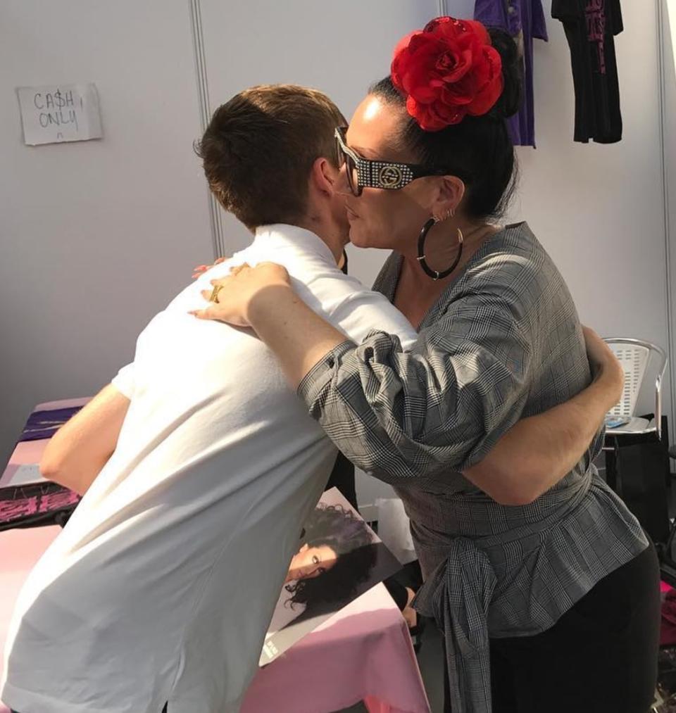 Michelle embracing a fan at DragWorld. Copyright: [Instagram]