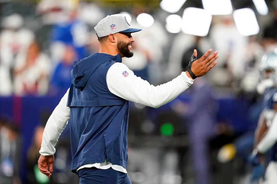 Dak Prescott walks onto the field with his thumb wrapped before the Cowboys faced the New York Giants at MetLife Stadium on Sept. 26.