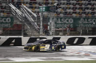 Chase Elliott crosses the finish line as he wins a NASCAR Cup Series auto race at Charlotte Motor Speedway Thursday, May 28, 2020, in Concord, N.C. (AP Photo/Gerry Broome)