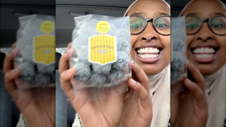 Underrated Hijabi holding up Black Death candy