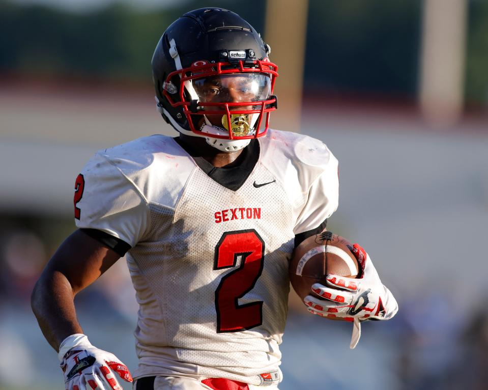 Sexton's John Douglas runs against Everett, Friday, Aug. 26, 2022, in Lansing.