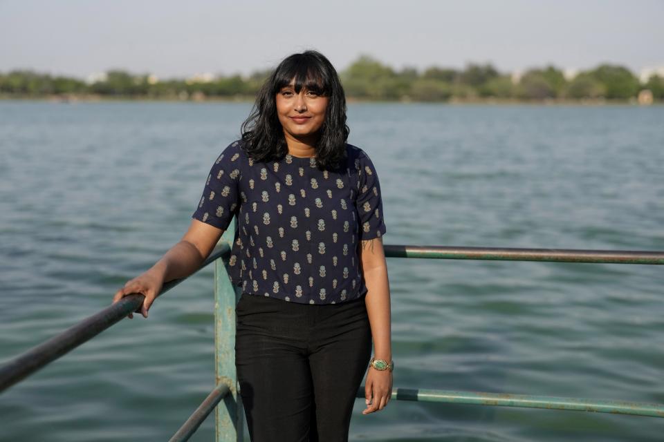 Indian climate change activist Disha Ravi poses for a photograph at Jakkur lake in Bengaluru, India, Friday, April 14, 2023. "Hope is a sewer rat," says Ravi, a 24-year-old Indian climate activist with Fridays for Future and a vocal proponent of linking various environmental and people's rights issues in India with climate-related activism. (AP Photo/Aijaz Rahi)