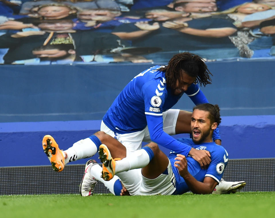 LIVERPOOL, ENGLAND - OCTOBER 17: (THE SUN OUT, THE SUN ON SUNDAY OUT )Everton's Dominic Calvert-Lewin scores the second goal making the score 2-2 and celebrates during the Premier League match between Everton and Liverpool at Goodison Park on October 17, 2020 in Liverpool, England. Sporting stadiums around the UK remain under strict restrictions due to the Coronavirus Pandemic as Government social distancing laws prohibit fans inside venues resulting in games being played behind closed doors. (Photo by Andrew Powell/Liverpool FC via Getty Images)