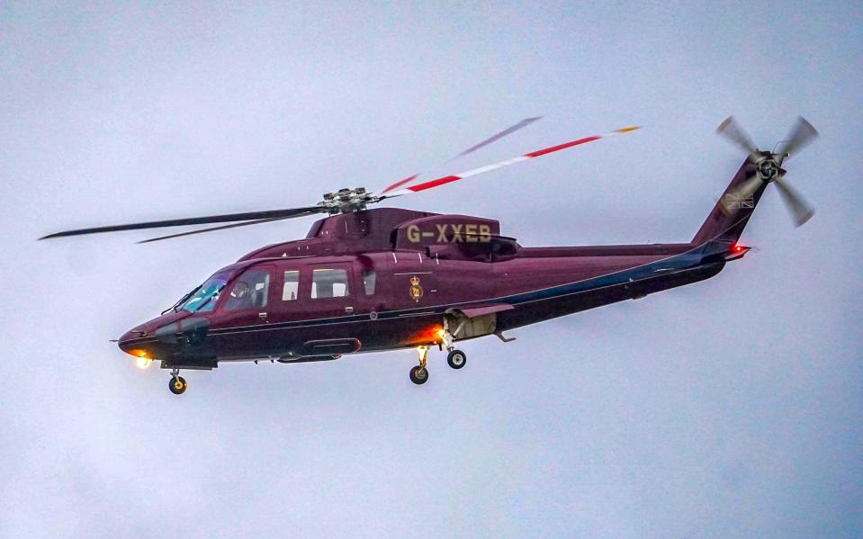 King Charles and Queen Camilla arriving by helicopter at the Royal Sandringham estate in Norfolk