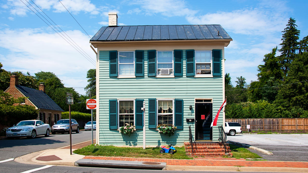 Leesburg, USA - August 6, 2014: Main Street in Historic Town of Leesburg, Virginia with stores, restaurants and parked cars.