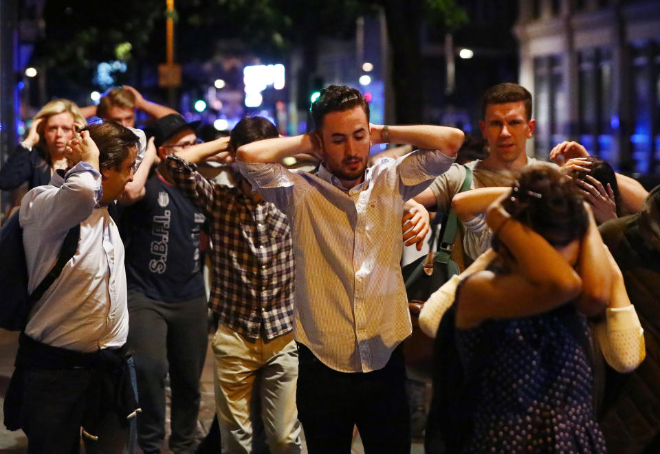 <p>People leave the area with their hands up after an incident near London Bridge in London, Britain June 4, 2017. (Neil Hall/Reuters) </p>