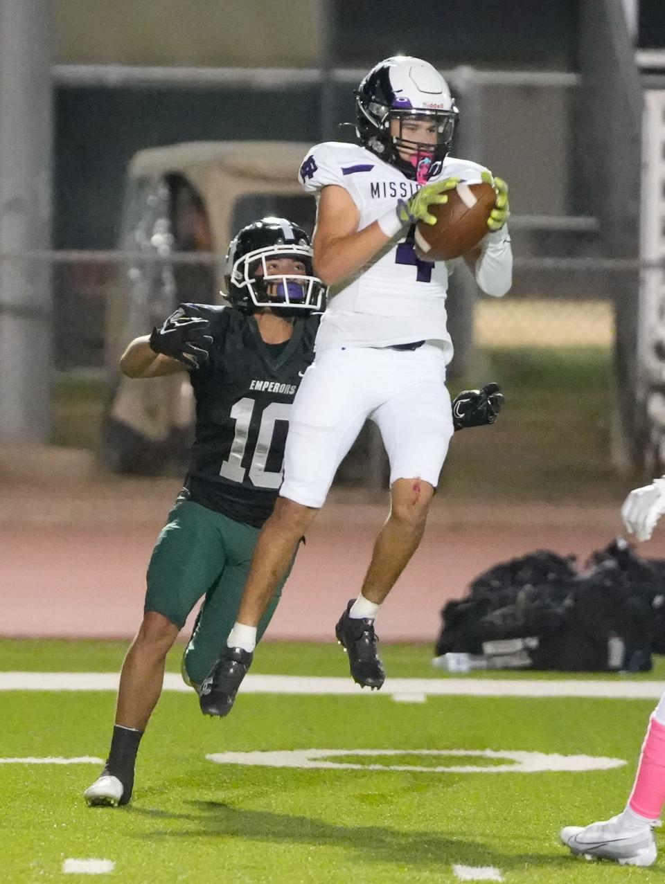 Mission Oak's Cameron Azevedo makes the interception of a pass intended for Dinuba's Christian Lopez late in the game on Friday in Dinuba.