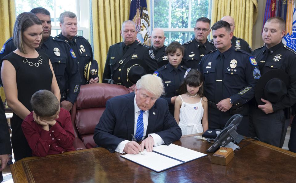 President Donald Trump signs a proclamation supporting police officers at the White House on May 15, 2017 in Washington, DC.