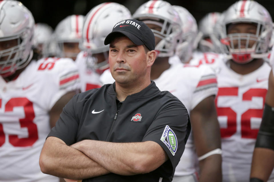 FILE - In this Sept. 28, 2019, file photo, Ohio State head coach Ryan Day waits with his players before taking the field for an NCAA college football game against Nebraska, in Lincoln, Neb. A year ago, Day was a relatively unknown Ohio State assistant. This December he's reigning Big Ten coach of the year and is eyeing a national title after leading the Buckeyes to a 13-0 record as the successor to the retiring Urban Meyer. (AP Photo/Nati Harnik, File)