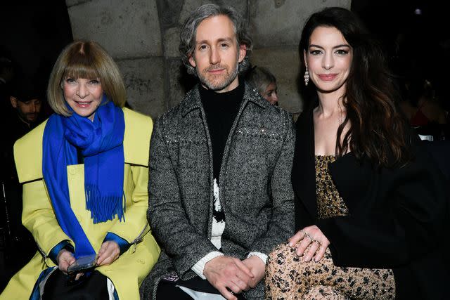 <p>Dominique Maitre/WWD via Getty</p> Anna Wintour, Adam Shulman, and Anne Hathaway in the front row at Valentino Couture Spring 2023 photographed on January 26, 2023 in Paris.