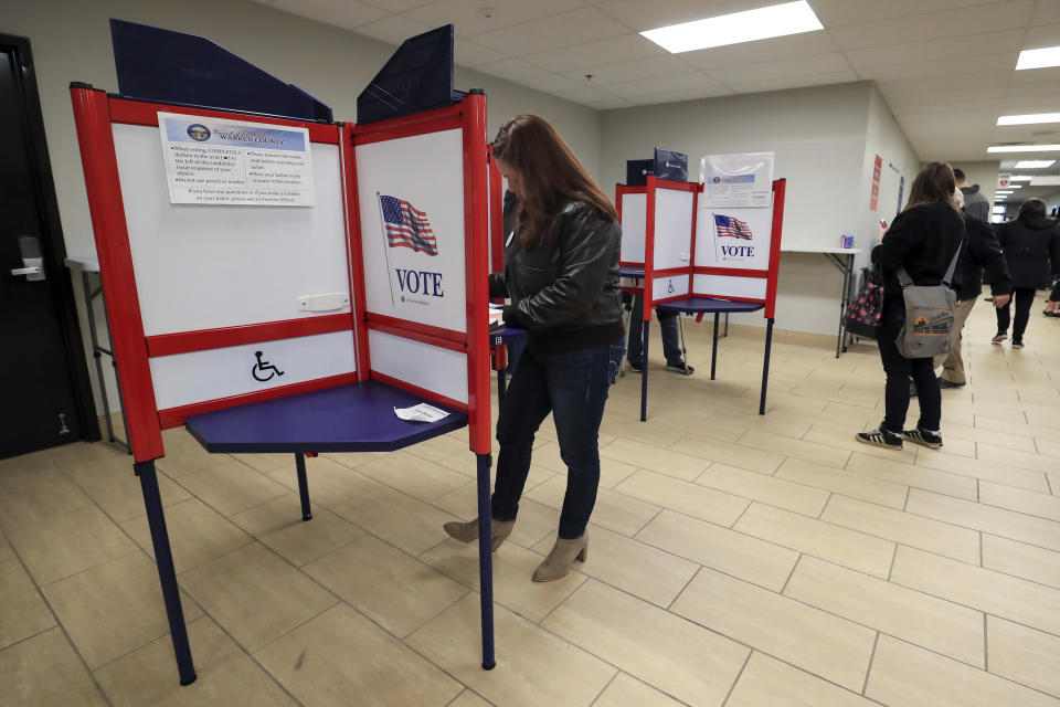 Nikki Foster, democratic candidate for Ohio's first congressional district, votes early at the Warren County Board of Elections, Saturday, March 14, 2020, in Lebanon, Ohio. (AP Photo/Aaron Doster)