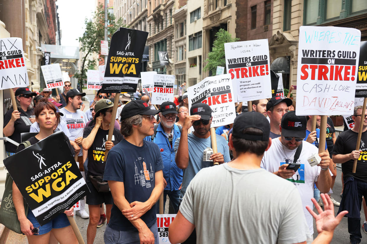 WGA and SAG-AFTRA members on the picket line in July. (Michael M. Santiago / Getty Images)