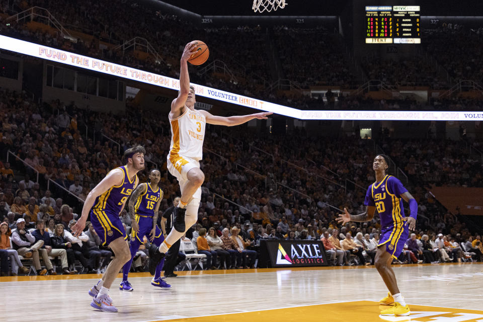 Tennessee guard Dalton Knecht (3) shoots past LSU forward Will Baker (9) during the first half of an NCAA college basketball game Wednesday, Feb. 7, 2024, in Knoxville, Tenn. (AP Photo/Wade Payne)