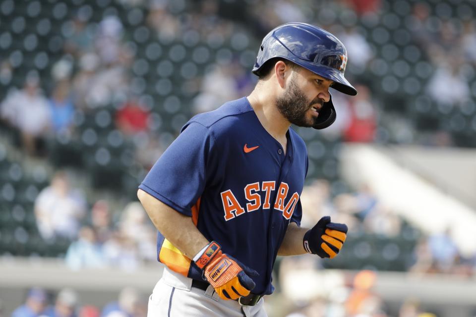 Houston Astros' Jose Altuve runs to first base after getting hit with a pitch during the fifth inning of a spring training baseball game against the Detroit Tigers, Monday, Feb. 24, 2020, in Lakeland, Fla. (AP Photo/Frank Franklin II)