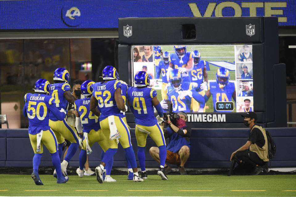 Los Angeles Rams players celebrate after an interception by Jalen Ramsey during the second half of an NFL football game against the Chicago Bears Monday, Oct. 26, 2020, in Inglewood, Calif. (AP Photo/Kelvin Kuo)