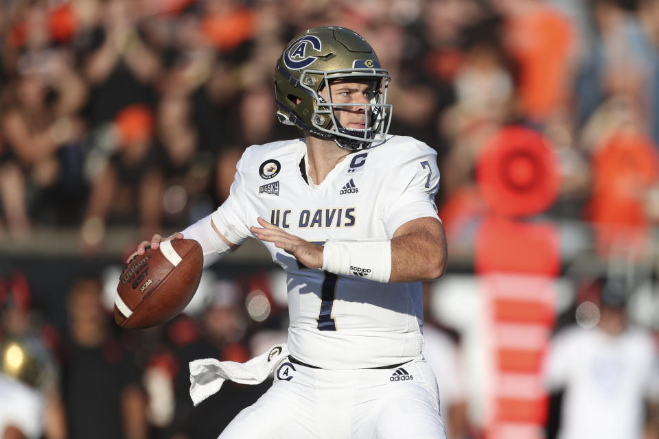 UC Davis quarterback Miles Hastings drops back to pass during the first half of the team's NCAA college football game against Oregon State on Saturday, Sept. 9, 2023, in Corvallis, Ore. (AP Photo/Amanda Loman)