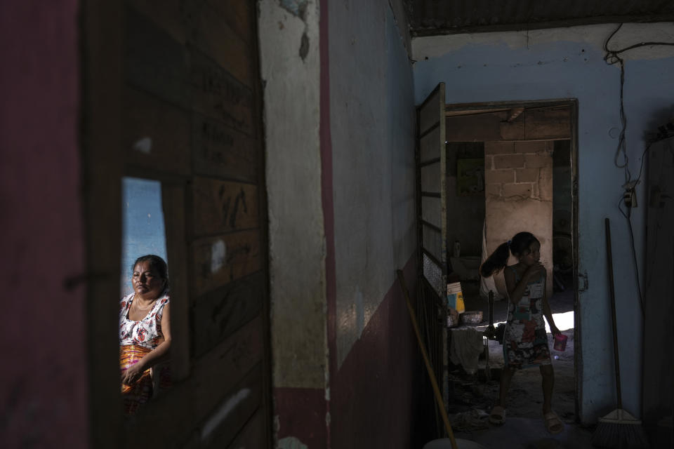 Climate refugee Áurea Sánchez sits inside the home she is renting, in Frontera, in the state of Tabasco, Mexico, Thursday, Nov. 30, 2023. Sanchez and her family were driven from their home when flooding driven by a Gulf of Mexico sea-level rise destroyed their coastal community of El Bosque. (AP Photo/Felix Marquez)