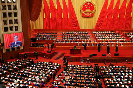 Chinese Premier Li Keqiang addresses delegates during the opening session of the National People's Congress (NPC) at the Great Hall of the People in Beijing, China March 5, 2018. REUTERS/Damir Sagolj