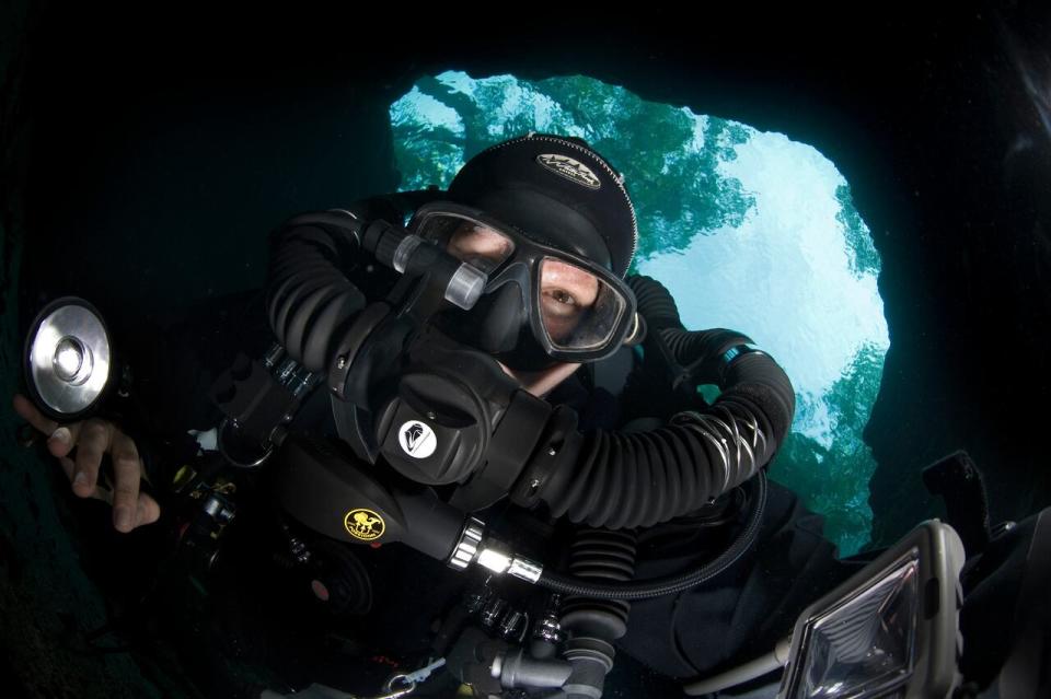 Diver Jill Heinerth clicks a selfie underwater while cave diving in Florida.