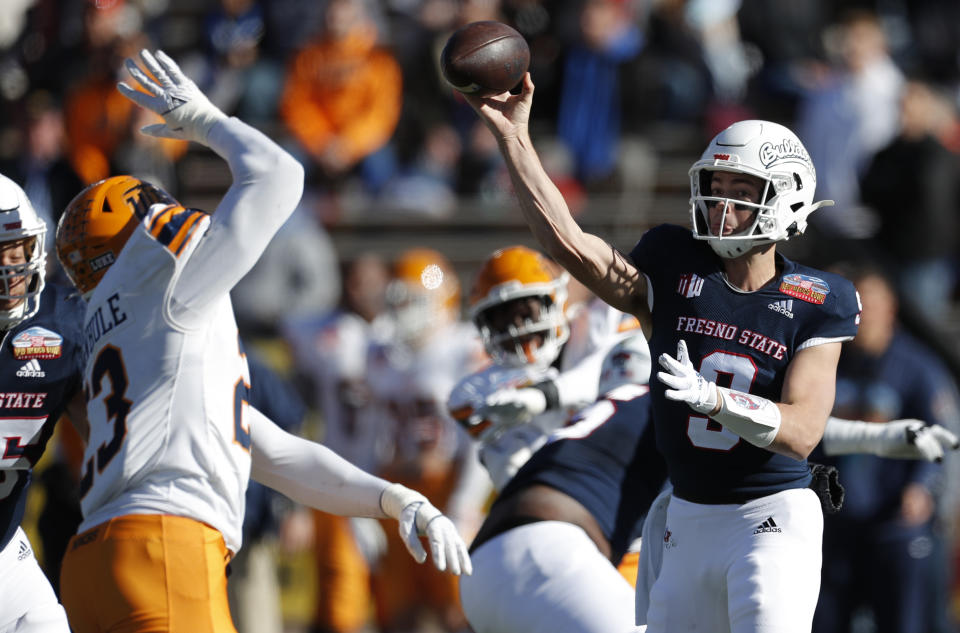 Fresno State quarterback Jake Haener (9) throws against UTEP during the first half of the New Mexico Bowl NCAA college football game Saturday, Dec. 18, 2021, in Albuquerque, N.M. (AP Photo/Andres Leighton)