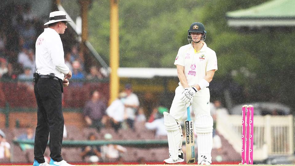 Steve Smith waiting to bat in the rain at the SCG.