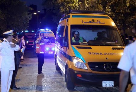 Police open the way for ambulances carrying the bodies of passengers of a Russian airliner which crashed in Sinai, into a morgue in Cairo, Egypt, October 31, 2015. REUTERS/Asmaa Waguih