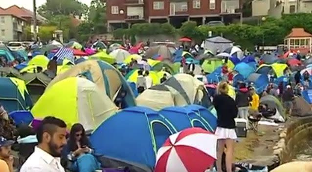 Hundreds of residents camped out overnight in the rain to secure the best Sydney firework spots. Photo: 7 News