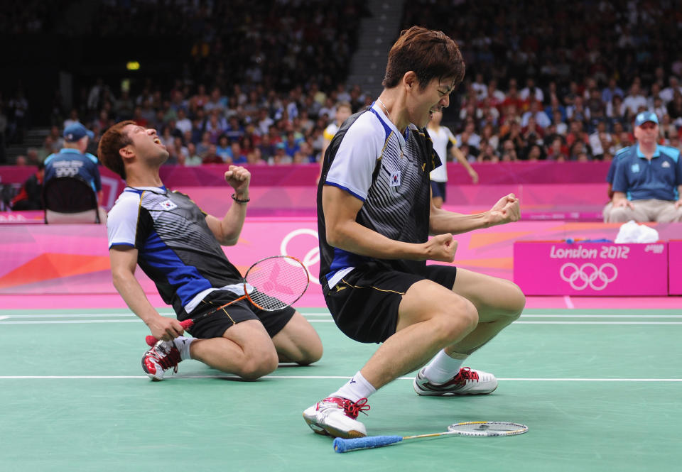 LONDON, ENGLAND - AUGUST 02: Yong Dae Lee (R) and Jae Sung Chung (L) of Korea celebrate beating Tontowi Ahmad and Lilyana Natsir of of Indonesia in their Men's Doubles Badminton quarter final on day 6 of the London 2012 Olympic Games at Wembley Arena on August 2, 2012 in London, England. (Photo by Michael Regan/Getty Images)