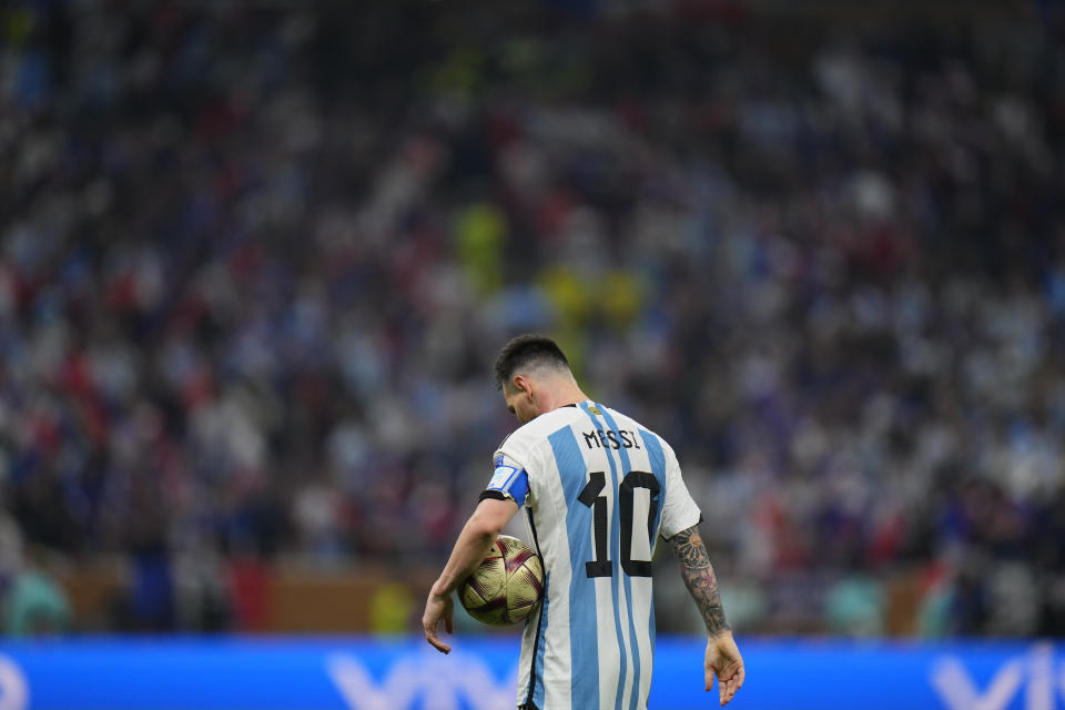 Argentina's Lionel Messi holds the ball during the World Cup final soccer match between Argentina and France at the Lusail Stadium in Lusail, Qatar, Sunday, Dec. 18, 2022. (AP Photo/Petr David Josek)