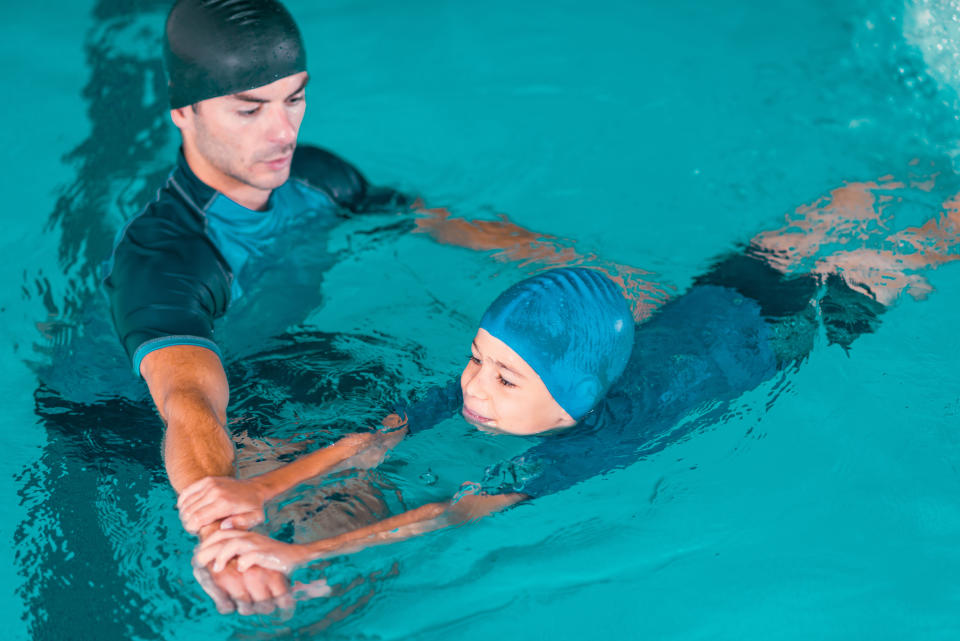 Swimming instructor and student