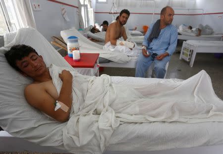 A wounded Afghan man, who survived last night's attack at American University of Afghanistan, receives treatment at the Emergency Hospital in Kabul, Afghanistan August 25, 2016. REUTERS/Omar Sobhani