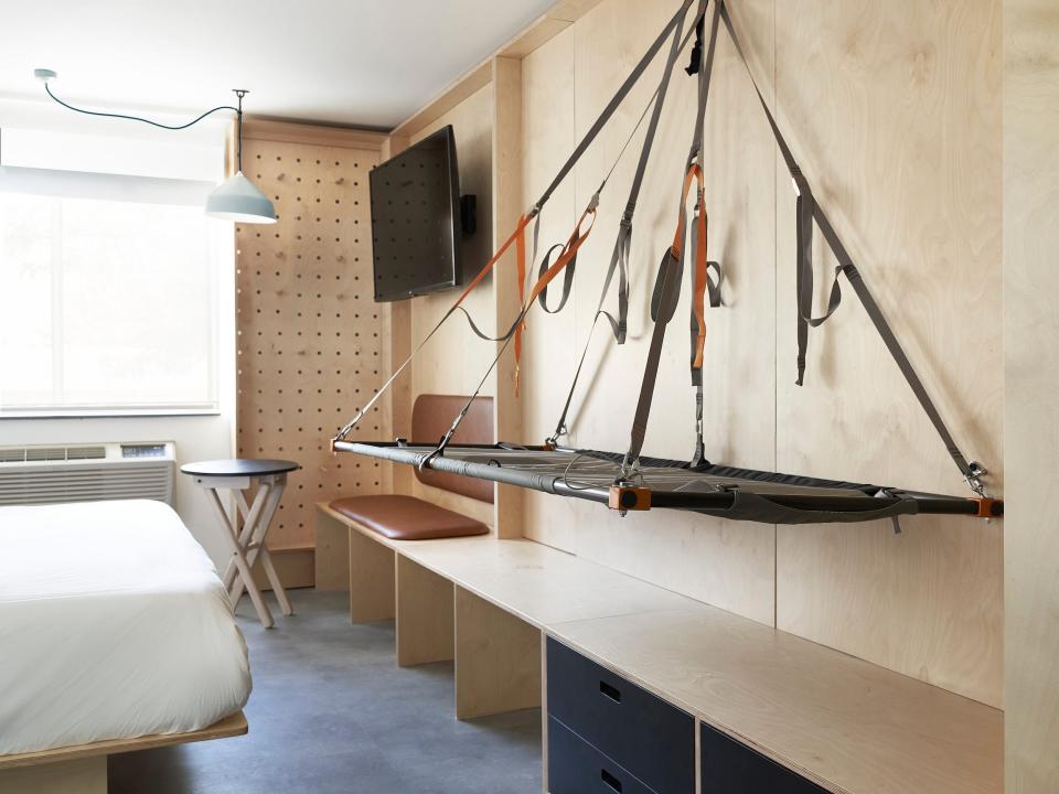 Inside a Field Station hotel room with a bed, furniture.