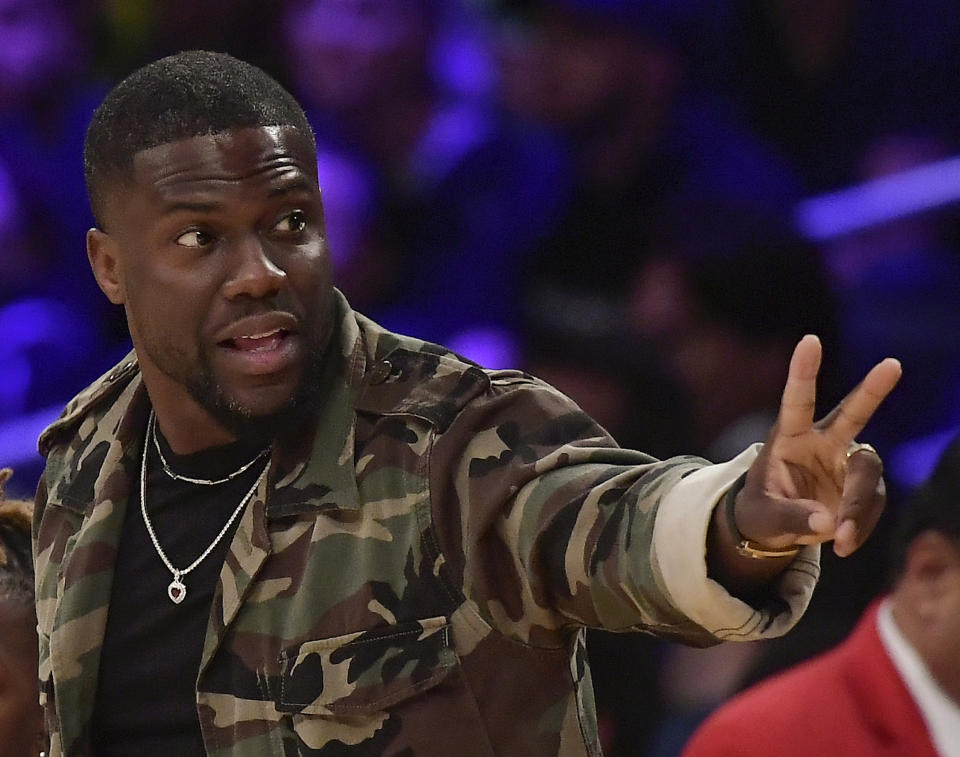 FILE - In this Jan. 29, 2019, file photo, actor Kevin Hart gestures during the second half of an NBA basketball game between the Los Angeles Lakers and the Philadelphia 76ers in Los Angeles. Hart has been injured in a car crash in the hills above Malibu on Sunday, Sept. 1. (AP Photo/Mark J. Terrill, File)