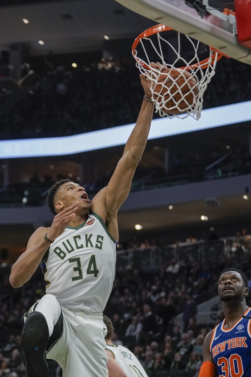 Milwaukee Bucks' Giannis Antetokounmpo dunks during the second half of an NBA basketball game against the New York Knicks Tuesday, Jan. 14, 2020, in Milwaukee. (AP Photo/Morry Gash)