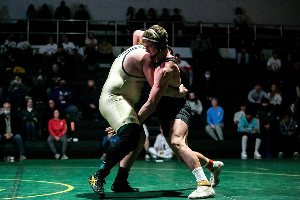 Iowa City High's Ben Kueter, right, wrestles Iowa City West's Brett Pelfrey at 285 pounds during a Class 3A varsity wrestling dual, Wednesday, Dec. 22, 2021, at West High School in Iowa City, Iowa.