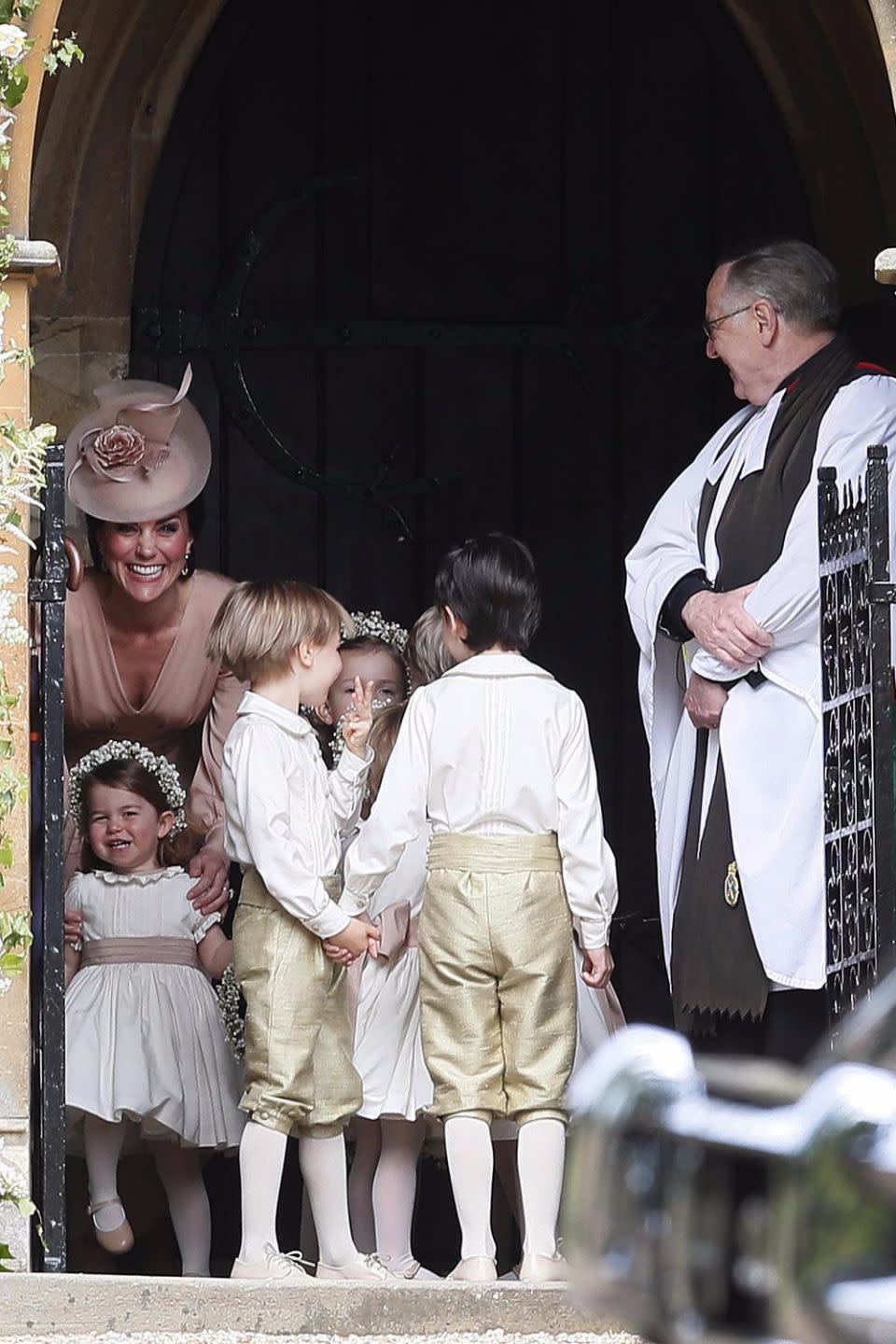 Kate couldn't hide an enormous grin when she first saw her sister arrive at the church. Source: Getty