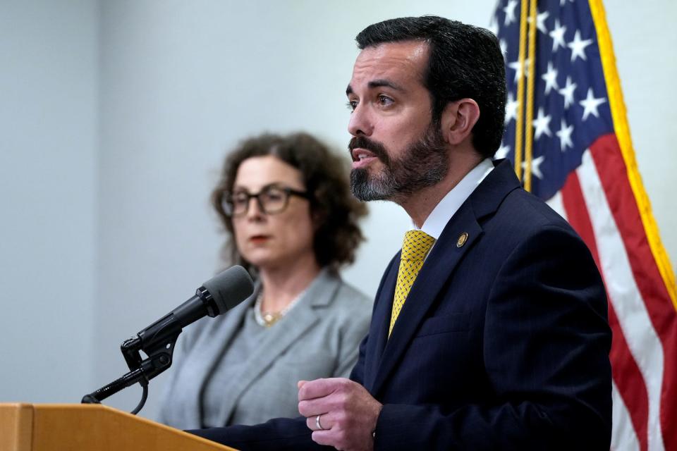 U.S. Attorney Zachary Cunha on Monday announces violations of federal disability laws in the over-hospitalization of children with behavioral disabilities in the state's care. Behind him is Susan Rhodes, regional manager in the Office of Civil Rights, U.S. Department of Health and Human Services.