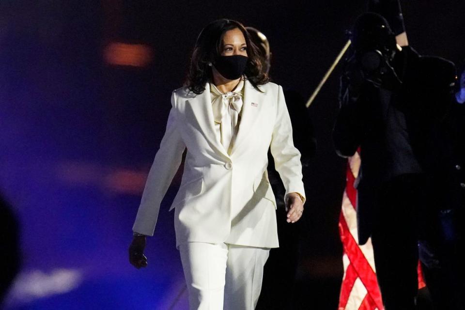 Vice President-elect Kamala Harris walks on the stage before speaking to the nation ahead of President-elect Joe Biden in Wilmington, Del., Saturday, Nov. 7, 2020.