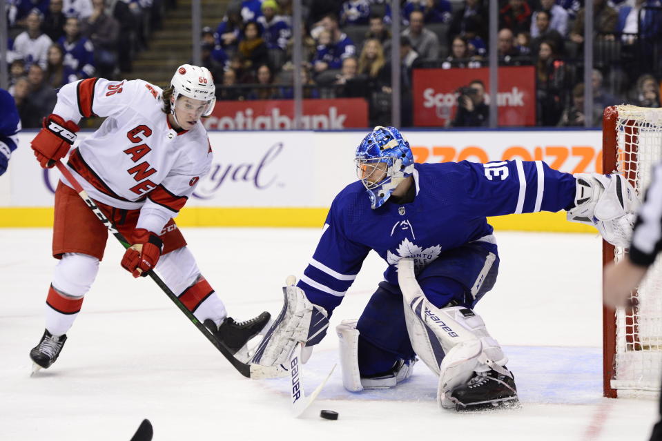 Toronto Maple Leafs goaltender Frederik Andersen (31) makes a save on Carolina Hurricanes left wing Erik Haula (56)during third period NHL hockey action in Toronto, Monday, Dec. 23, 2019. (Frank Gunn/The Canadian Press via AP)