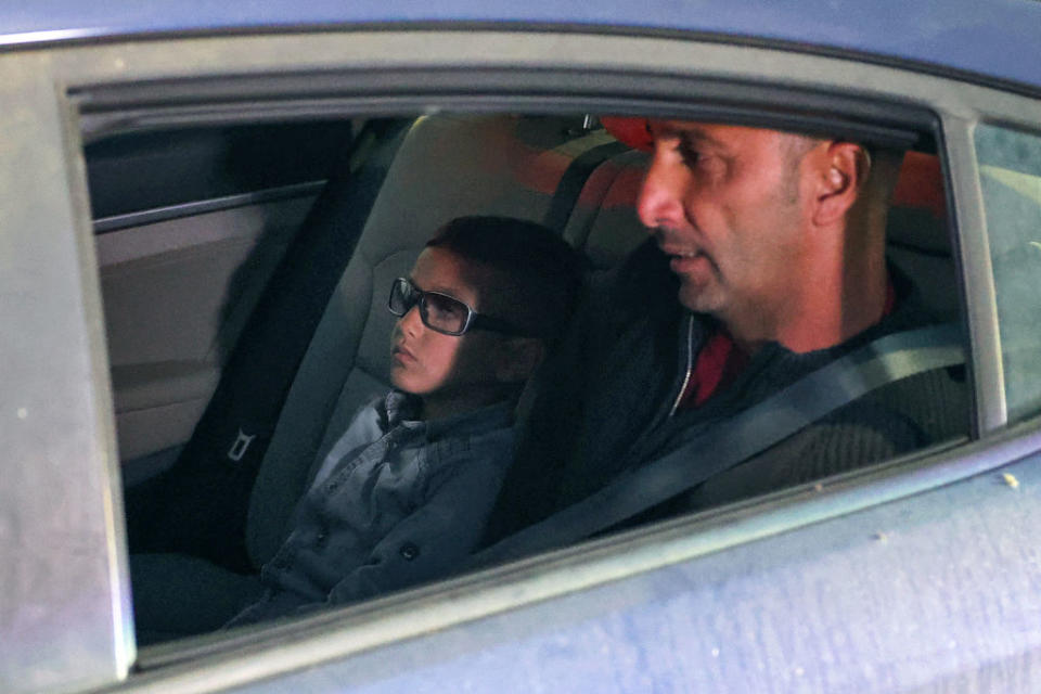 Adam Abu al-Rob sits in the backseat with his father Mamoun on May 22, 2023. <span class="copyright">Jack Guez—AFP/Getty Images</span>