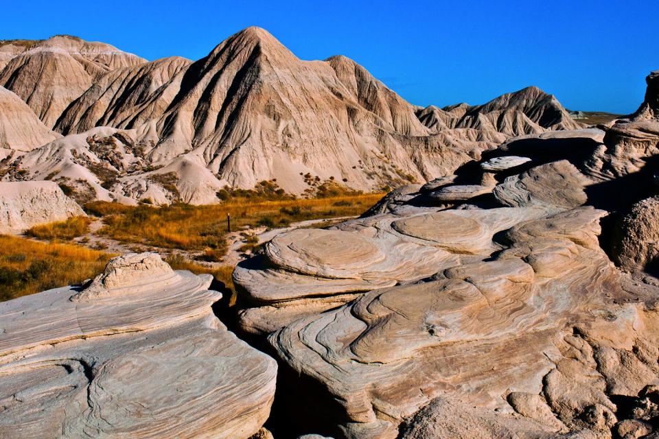 Swirling rock patterns at Toadstool Geologic Park, Nebraska, USA