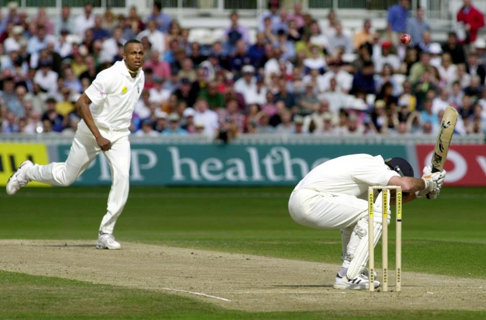 <p>Fearsome sight: Courtney Walsh puts the frighteners on Graeme Hick in 2000<br></p>
