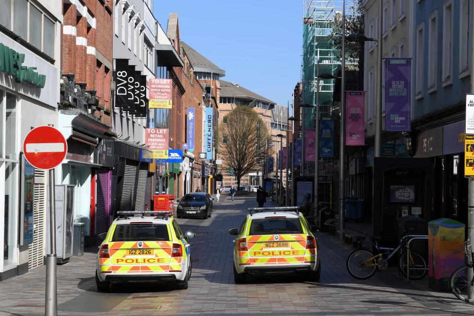 Shuttered stores and police patrols on Ann Street in Belfast, as the UK continues in lockdown to help curb the spread of the coronavirus.